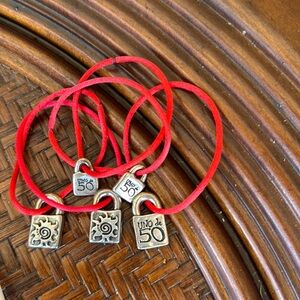 Uno de 50 red bracelet with ticket of authenticity.